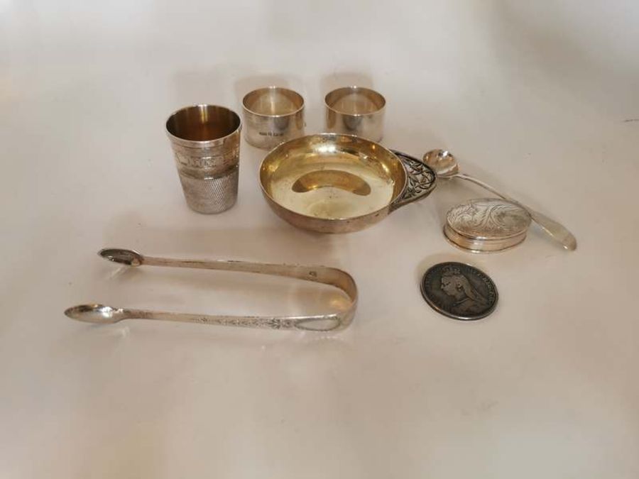 Group of Sterling silver items to include; thimble, wine taster, napkin rings, pill box, bright