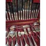 An eight place setting cased canteen of silver plated stainless steel cutlery by Inkerman.