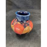 Two  Moorcroft  vases, small Pomegranate 8cm high, and second Pansy with chip to base 11.5 cms.