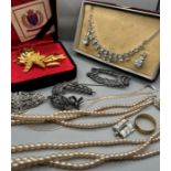 A selection of Early and later 20th costume jewellery to include simulated pearls, a Vintage Trifari