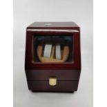 Automatic watch winder in red case. With space for two watches. Untested.