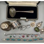 A selection of silver to include bracelets, fob medals, a silver  baby spoon, a silver ring box