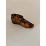 Treacle Glaze Boot inkwell. Small nibbles to the ink holes. 10cm long. Small nibbles to the ink