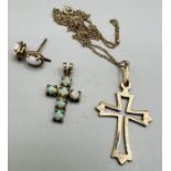A selection of gold and yellow metal jewellery. Comprising a natural white opal 9ct gold cross