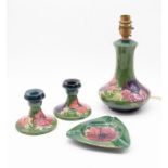 Moorcroft Pottery: A collection of green ground 'Anemone' patterned pieces to include a triangular