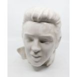 A moulded ceramic bust of Elvis in plain white colourway, unmarked possibly a trial piece.