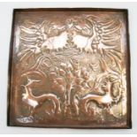 An Arts & Crafts square copper tray, the centre with repousse designs of dragons, eagles and a