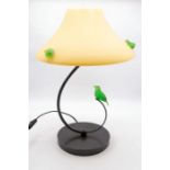 A 20th Century Trait D'union vasoline glass lamp with spiral stem leading to yellow glass shade,