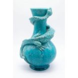 Burmantofts: A blue faience dragon vase of bottle shape with entwined climbing three clawed dragon