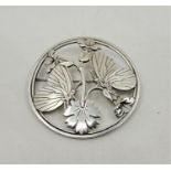 A Georg Jensen circular "Moonlight Blossom" sterling silver brooch, No.283, designed by Arno