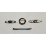 Four various silver and white metal brooches, to include an enamelled bar brooch, together with