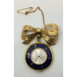 A Blita blue cloisonne enamel fob watch suspended from a yellow metal bow brooch. (enamel as found)