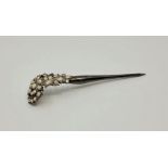 A 19th century white metal and baroque pearl set hair pin, length 12.8cm.