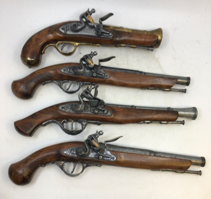 A collection of replica flintlock pistols