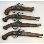 A collection of replica flintlock pistols