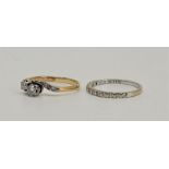 An 18ct. white gold half hoop diamond ring, channel set twelve brilliant cut diamonds (ETDS 0.24