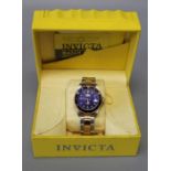 A boxed Invicta stainless steel automatic watch in brand new condition with box and papers