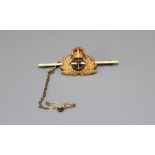 A 9ct gold Royal Navy sweetheart brooch featuring an enamelled crown topped anchor, surrounded by