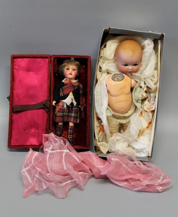 An ealy 20th century Armand Marseille bisque head doll, mould number 518/1, composition body and