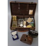 A small leather writing/document case containing a mixed lot of collectors items including two