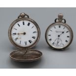 A pair of sterling silver pocket watches. One a full Hunter case key wound watch, in as found