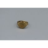 An 18ct gold signet ring, with faint remnants of initials. Hallmarked Birmingham 1916. Size R.