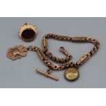 A 9c stamped fancy link watch with 9ct gold shield fob and bar shield marked Birmingham 1907. Weight