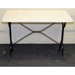 A veined white marble and cast iron patio/garden table, the rectangular top on splayed end