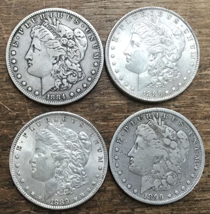 Four US Morgan Silver Dollars, 1884, 1986, 1889 & 1899o.