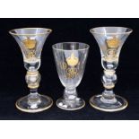 A pair of George V Coronation commemorative baluster wine glasses, each with GVR monogram, 1911