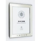 A silver photo frame, 7" x 5", with feature hallmark for 2023 • A new commemorative mark has been