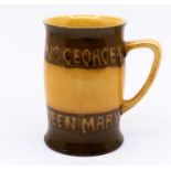 A Moorcroft commemorative mug, celebrating the silver jubilee of King George V and Queen Mary 1910-