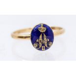 A gold, enamel and diamond ring, the oval blue enamel inlaid with a gold monogram for Alexander