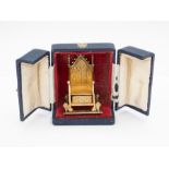 A Queen Elizabeth II silver gilt model of the coronation throne, approx 7.5cm high, approx 3ozt, S J