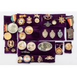 A quantity of commemorative badges and medallions, from Queen Victoria through to Queen Elizabeth