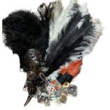 A quantity of antique ostrich feathers, an antique ostrich feather boa, buckles, scarf clips etc