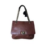 A brown leather Lanvin handbag with brass tone chain handle threaded with a black silk ribbon. The
