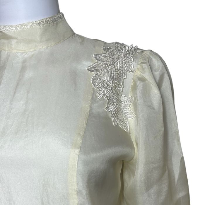 A 1970s Biba blouse in cream silk with guipure lace appliques, a cream cotton cheesecloth dress with - Image 2 of 4