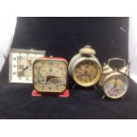 Vintage and antique Novelty clocks group ; to include a bell arum clock with Masonic Interest