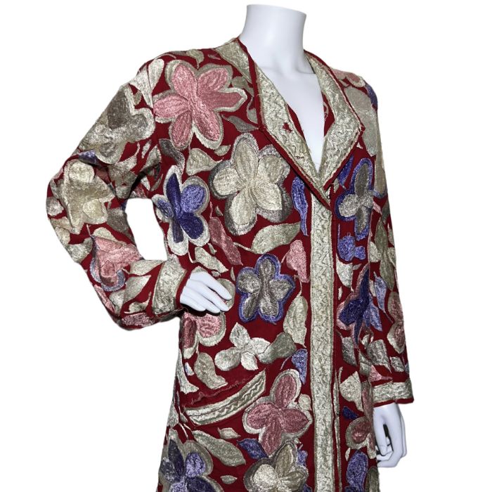 An heavily embroidered early 20th century ethnic coat in red cotton and a silk kaftan in the - Image 2 of 2