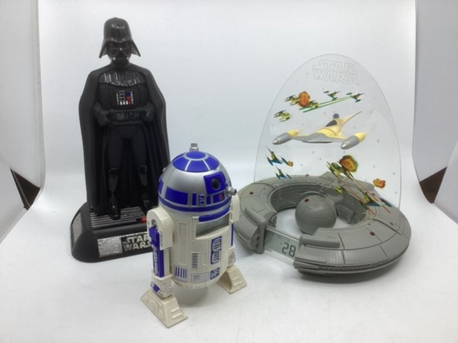 Vintage Star Wars toy Clocks ; to include a starfighter craft in frame with noise nad sounds play