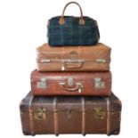 vintage luggage to include an early 20th century steamer trunk with stickers, two suitcases, one