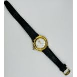An Yves Saint Laurent quartz movement watch. Ivory dial with gold batons, second dial and date