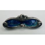 A collection of silver and costume jewellery featuring a sterling silver enamel brooch, a stone