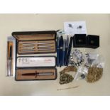 Two parker biros and a propelling pencil, cased, a Parker Classic ball pen, A Shaeffer pen, with 14k