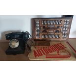 A 1950's black bakelite telephone, no 312F. an olivewood box and an autobridge game and instructions