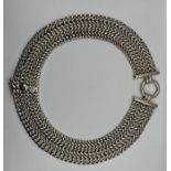 A designer sterling silver collar, comprising of four interconnected curb chains, with a central