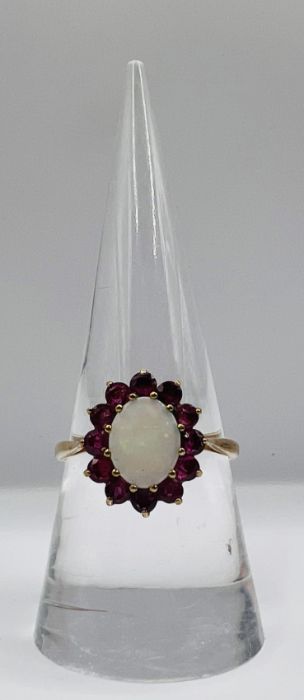 A 9ct gold Opal and ruby cluster ring with matching earrings. The opal featured in ther ring is en - Image 3 of 6