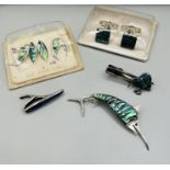 A selection of New Zealand made silver and Paua shell jewellery to include cuff links in the form of