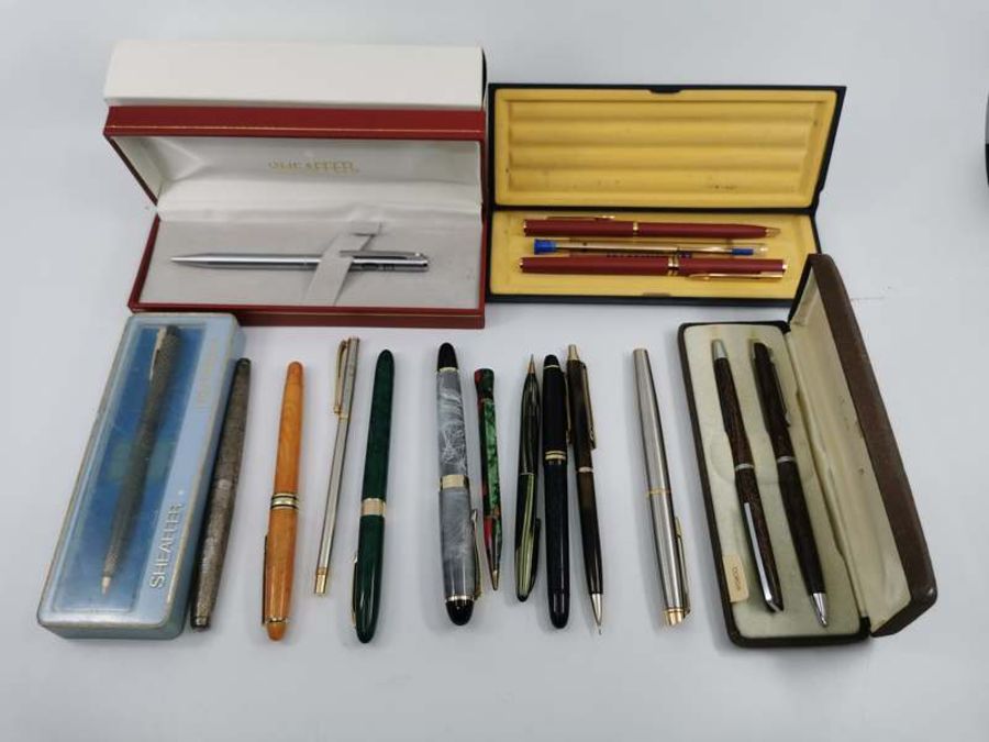 A selection of fountain pens, ballpoint pens and pencils by Shaeffer, Waterman, Hallmark and